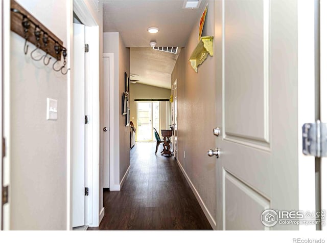 506 Bobcat Ct, Wiggins, CO 80654 - hall with baseboards and dark wood-style floors