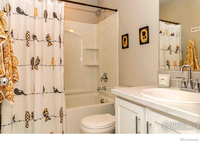 506 Bobcat Ct, Wiggins, CO 80654 - full bath featuring toilet, vanity, and shower / tub combo