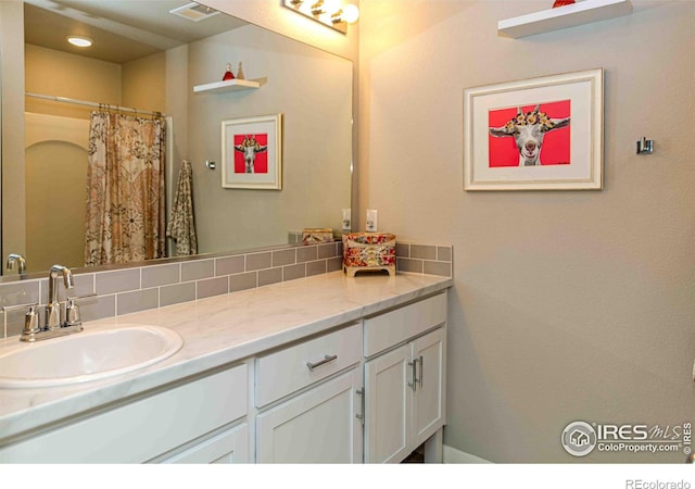 506 Bobcat Ct, Wiggins, CO 80654 - bathroom with vanity and a shower with curtain