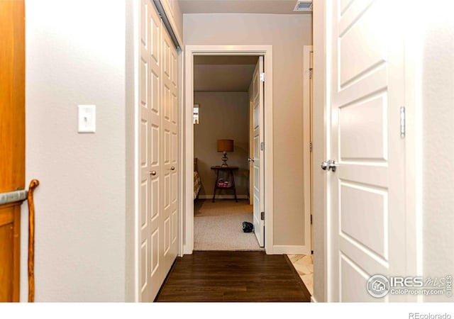 506 Bobcat Ct, Wiggins, CO 80654 - hall featuring wood finished floors and baseboards