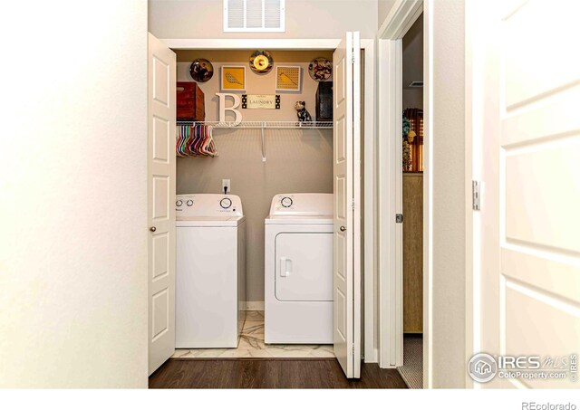 506 Bobcat Ct, Wiggins, CO 80654 - washroom with washer and clothes dryer and marble finish flooring