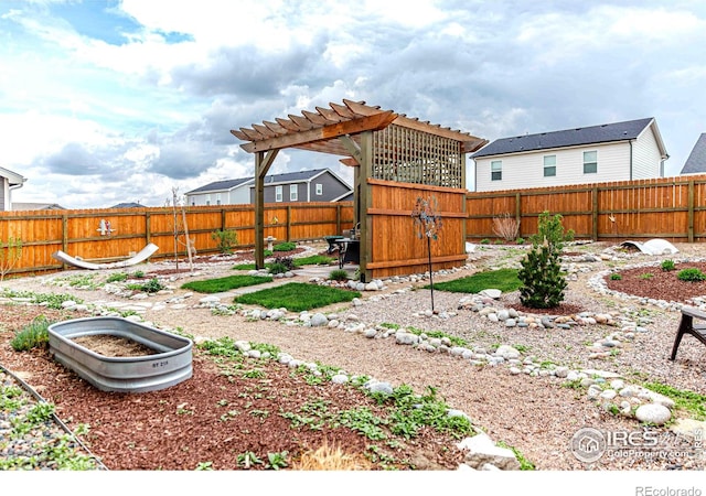 506 Bobcat Ct, Wiggins, CO 80654 - fenced backyard featuring a pergola and a patio area