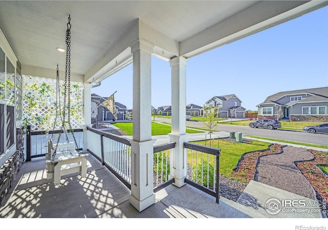 view of patio with covered porch and a residential view