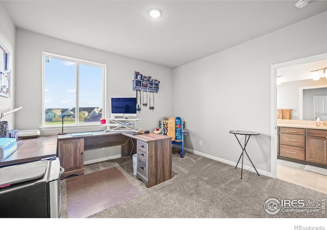 home office with healthy amount of natural light, baseboards, light carpet, and recessed lighting