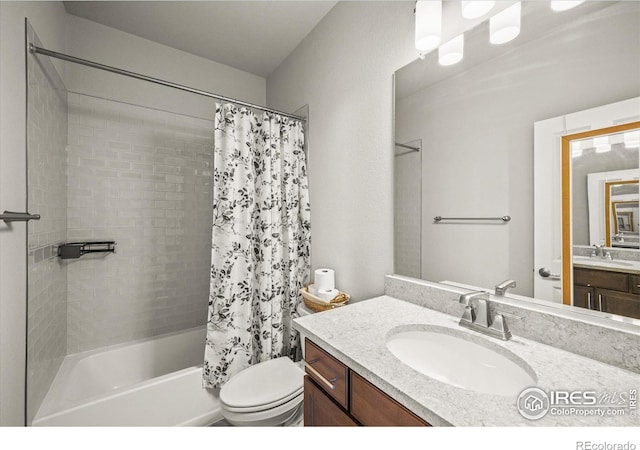 full bathroom with shower / bathtub combination with curtain, toilet, and vanity