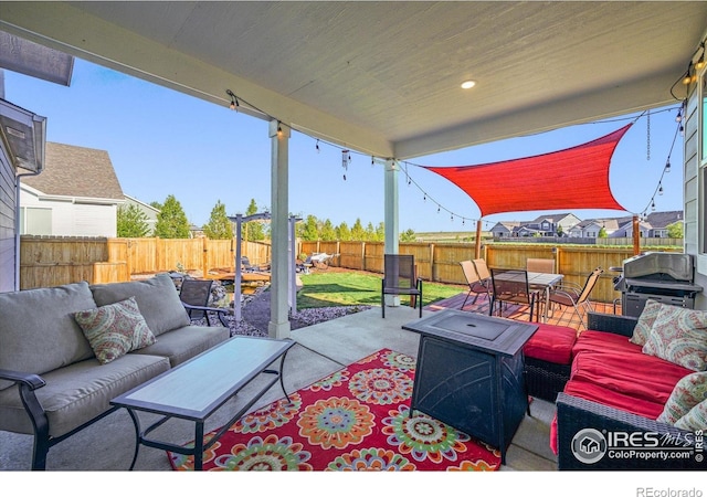 view of patio featuring outdoor lounge area, a fenced backyard, outdoor dining space, and a grill