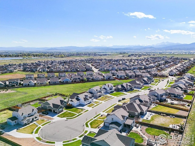 aerial perspective of suburban area featuring a mountainous background