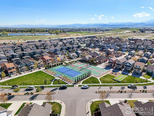aerial view of residential area with a water and mountain view