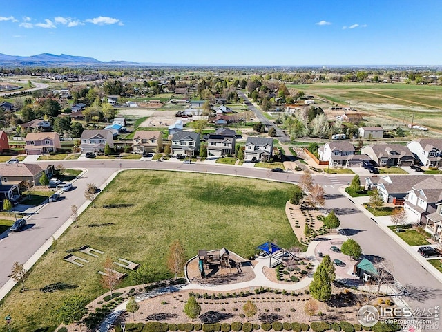 aerial view of residential area featuring mountains