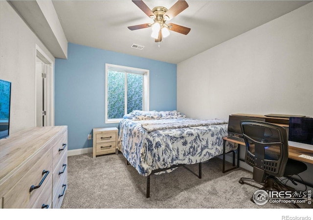 carpeted bedroom featuring ceiling fan and baseboards