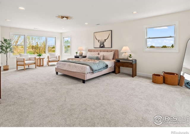 carpeted bedroom with recessed lighting and baseboards