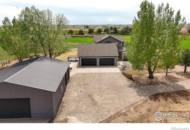 view of front of property with a garage and driveway