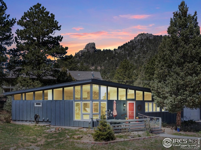 1411 Vail Ct, Estes Park, CO 80517 - rear view of property featuring board and batten siding
