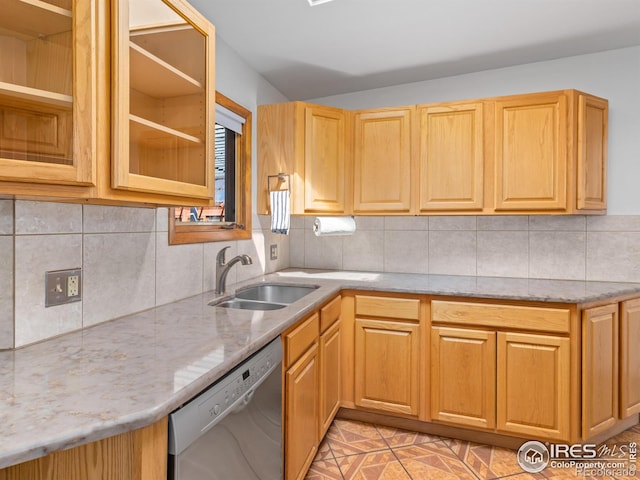 1411 Vail Ct, Estes Park, CO 80517 - kitchen with stainless steel dishwasher, a sink, light stone countertops, and backsplash
