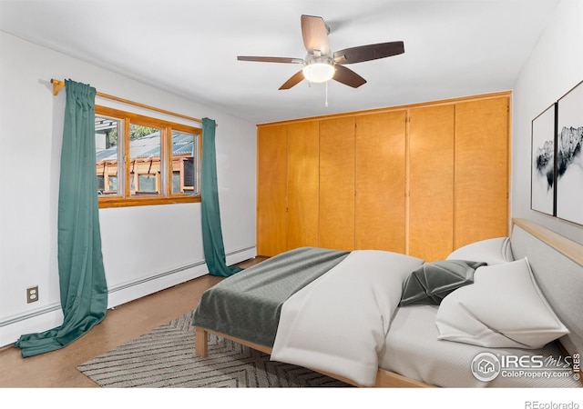1411 Vail Ct, Estes Park, CO 80517 - bedroom with baseboard heating and a ceiling fan