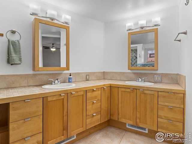 1411 Vail Ct, Estes Park, CO 80517 - full bathroom with double vanity, tile patterned floors, backsplash, and a ceiling fan