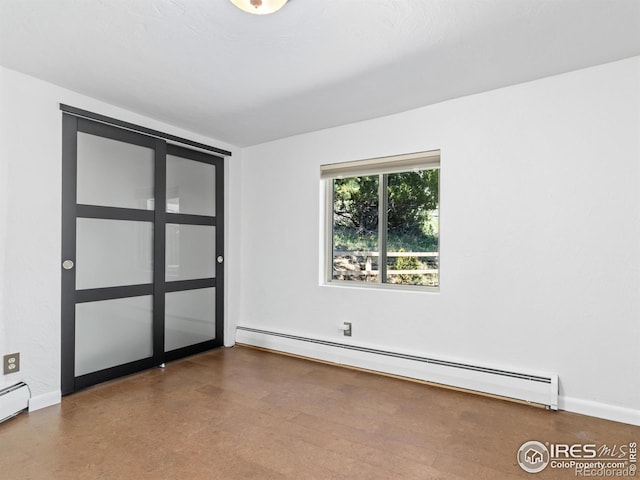 1411 Vail Ct, Estes Park, CO 80517 - empty room featuring a baseboard radiator and baseboards