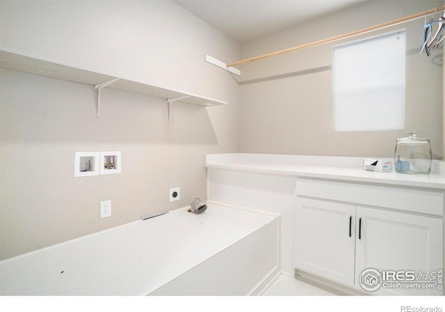 washroom featuring hookup for a washing machine, cabinet space, and electric dryer hookup