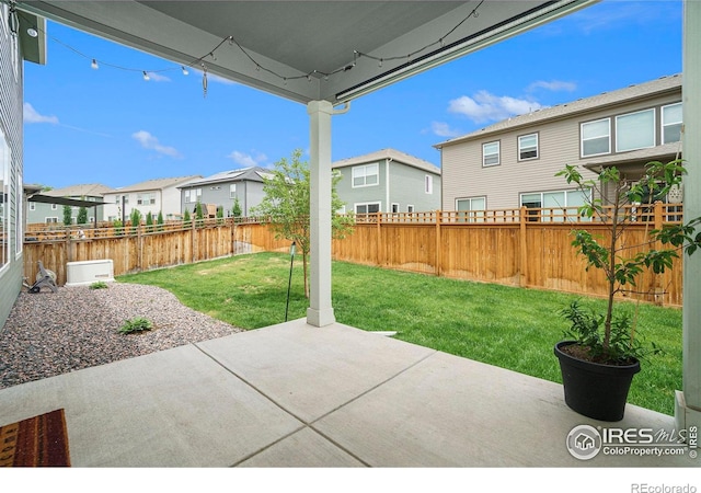 view of patio with a fenced backyard and a residential view