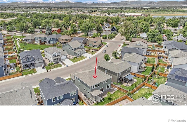 aerial view featuring a residential view and a mountain view