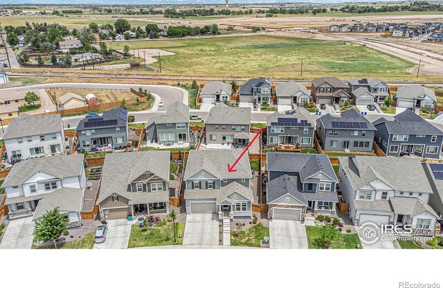 birds eye view of property with a residential view