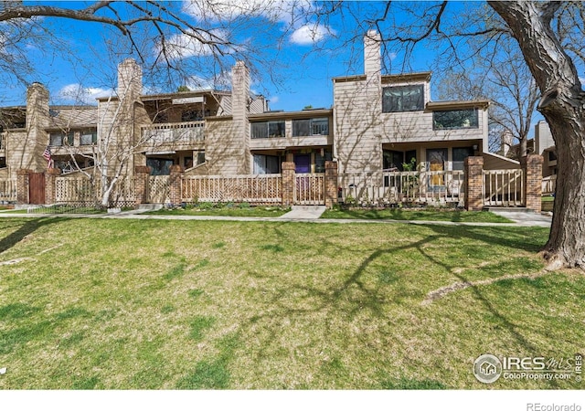 5086 Buckingham Rd, Boulder, CO 80301 - rear view of property featuring a yard and a chimney