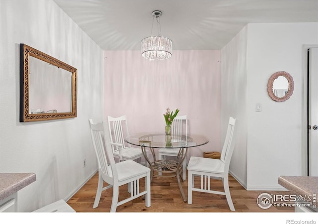 5086 Buckingham Rd, Boulder, CO 80301 - dining room with wood finished floors and a chandelier