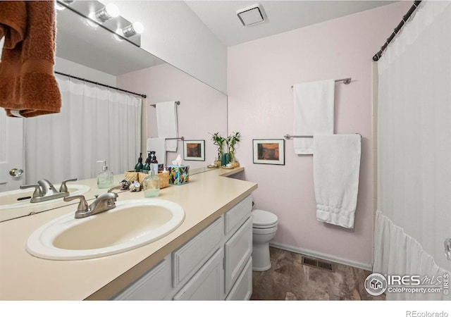 5086 Buckingham Rd, Boulder, CO 80301 - full bath featuring vanity, toilet, and baseboards