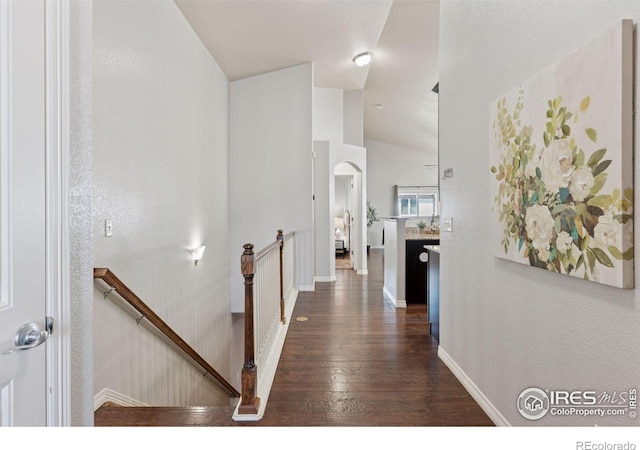 9137 Harlequin Cir, Frederick, CO 80504 - corridor featuring an upstairs landing, hardwood / wood-style flooring, vaulted ceiling, and baseboards