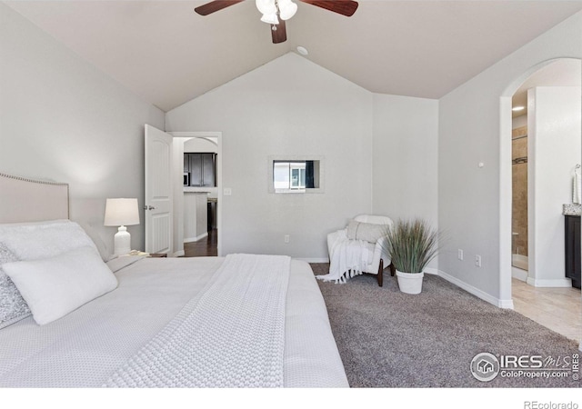 9137 Harlequin Cir, Frederick, CO 80504 - bedroom with arched walkways, carpet floors, vaulted ceiling, baseboards, and ceiling fan