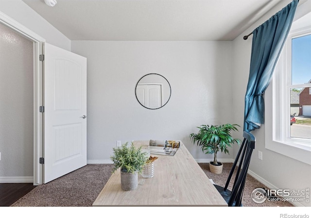 9137 Harlequin Cir, Frederick, CO 80504 - dining room featuring baseboards and dark carpet