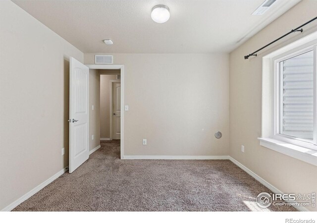 9137 Harlequin Cir, Frederick, CO 80504 - carpeted empty room featuring baseboards