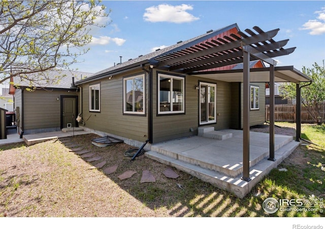 9137 Harlequin Cir, Frederick, CO 80504 - back of property with a patio area, a pergola, and fence