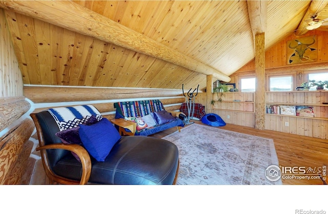 living area featuring hardwood / wood-style flooring, wooden ceiling, wood walls, and log walls