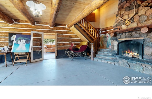 living room featuring log walls, wood ceiling, beamed ceiling, concrete flooring, and a stone fireplace