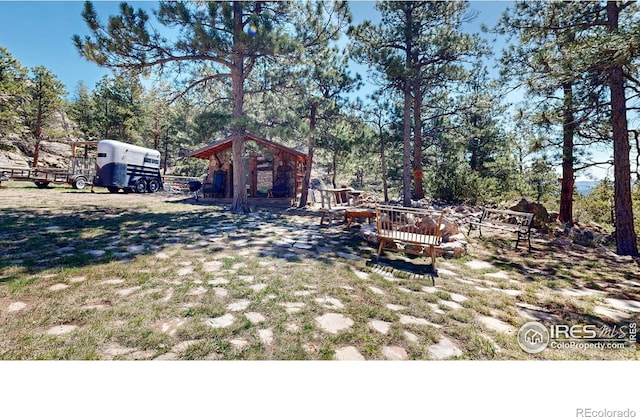 view of yard with an outdoor structure and a deck