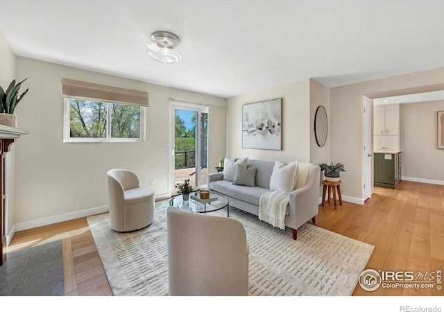 536 W Sycamore Cir, Louisville, CO 80027 - living area with light wood-type flooring and baseboards