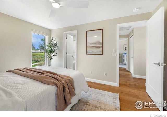 536 W Sycamore Cir, Louisville, CO 80027 - bedroom with wood finished floors, baseboards, a ceiling fan, and ensuite bath