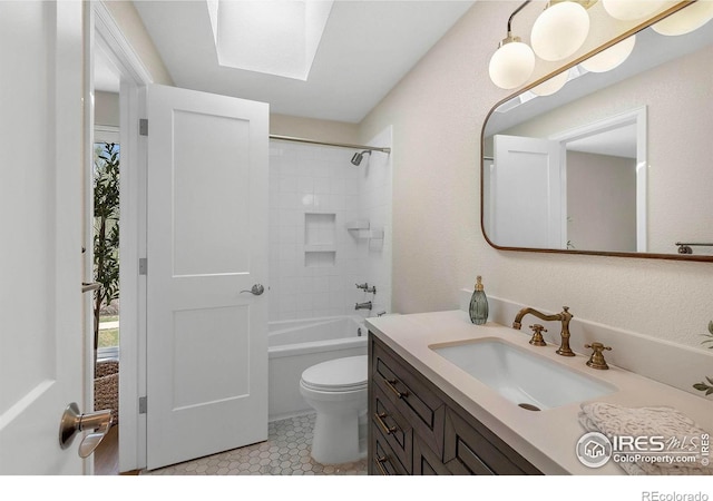 536 W Sycamore Cir, Louisville, CO 80027 - bathroom featuring vanity, toilet, a skylight, and tile patterned flooring