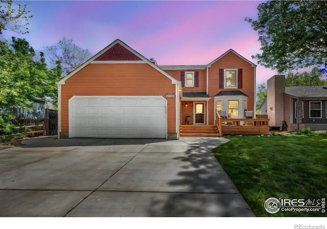 536 W Sycamore Cir, Louisville, CO 80027 - traditional-style house with driveway, an attached garage, and a front lawn