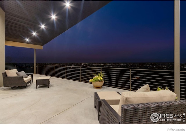 9360 Gold Mine Rd, Loveland, CO 80538 - patio at twilight featuring a balcony and outdoor lounge area