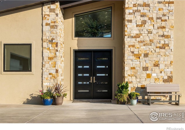 9360 Gold Mine Rd, Loveland, CO 80538 - view of exterior entry with stone siding and stucco siding