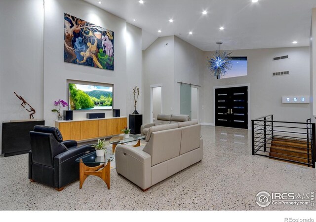 9360 Gold Mine Rd, Loveland, CO 80538 - living area with speckle patterned floor, a high ceiling, recessed lighting, and baseboards