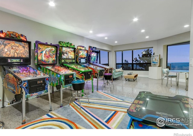 9360 Gold Mine Rd, Loveland, CO 80538 - game room featuring speckle patterned floor and recessed lighting