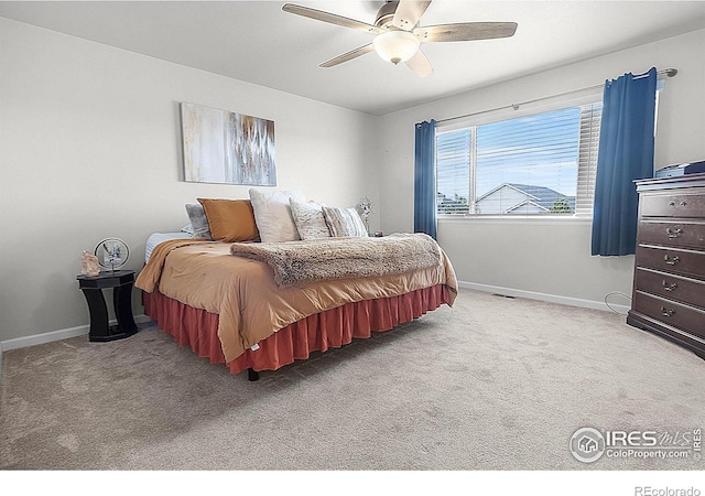 bedroom featuring carpet floors, baseboards, and ceiling fan