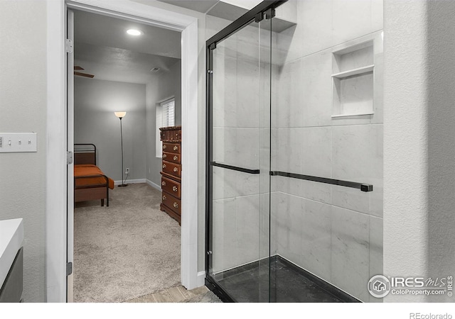 bathroom featuring a shower stall, baseboards, and recessed lighting