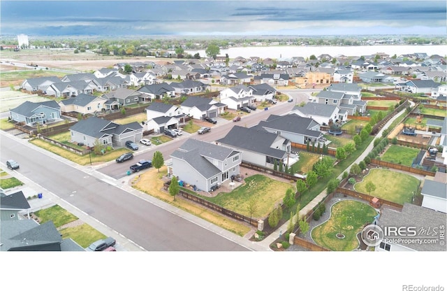 aerial perspective of suburban area featuring a large body of water