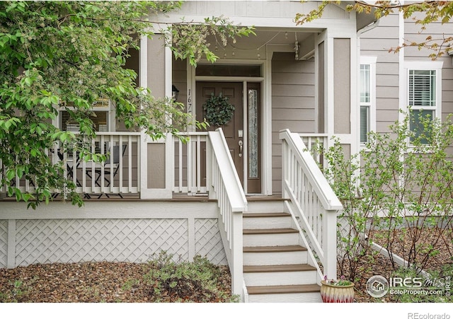 1675 Saratoga Dr, Lafayette, CO 80026 - view of exterior entry with a porch