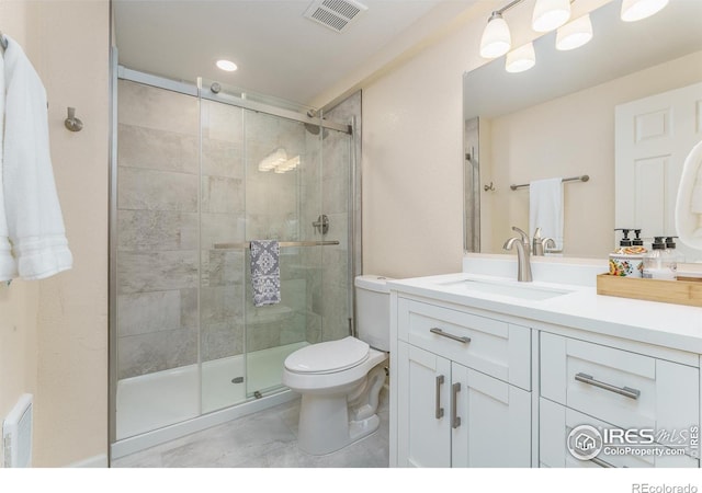 1675 Saratoga Dr, Lafayette, CO 80026 - bathroom featuring vanity, a shower stall, tile patterned floors, and recessed lighting