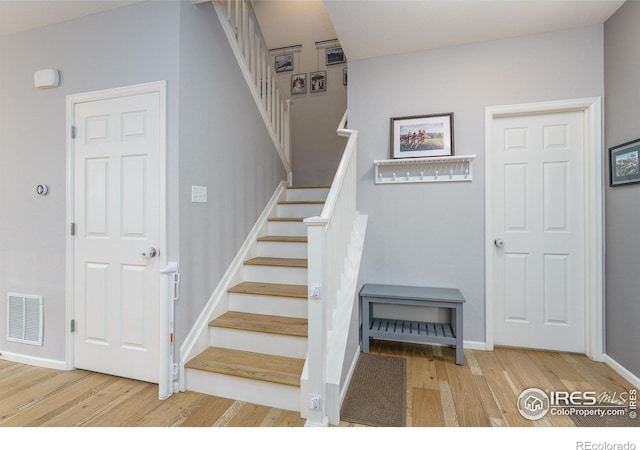1675 Saratoga Dr, Lafayette, CO 80026 - stairs with wood finished floors and baseboards
